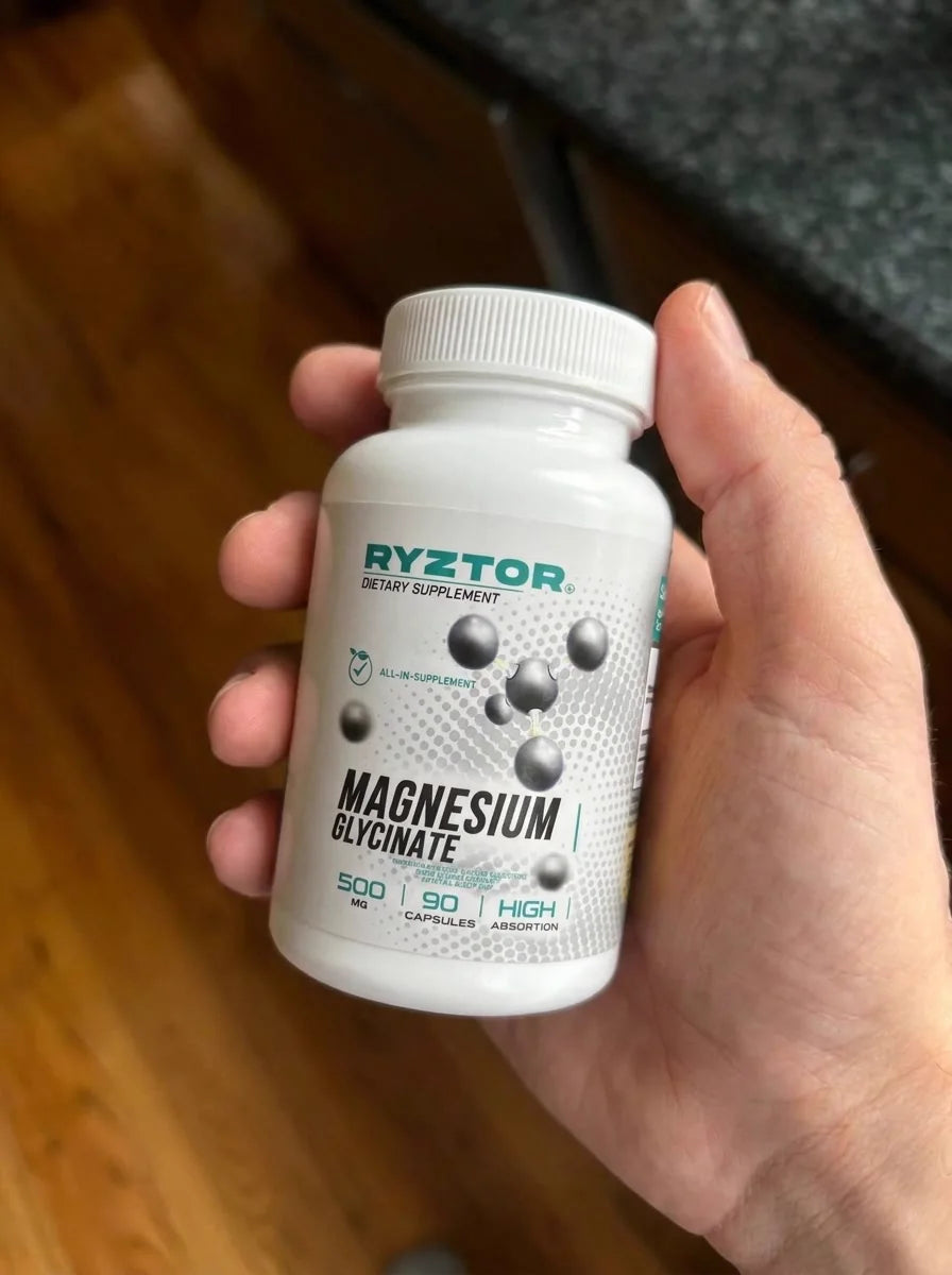 Bottle of RYZTOR Magnesium Glycinate in hand